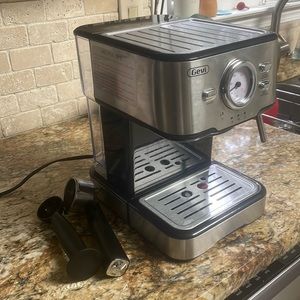 Espresso machine with built in milk frother